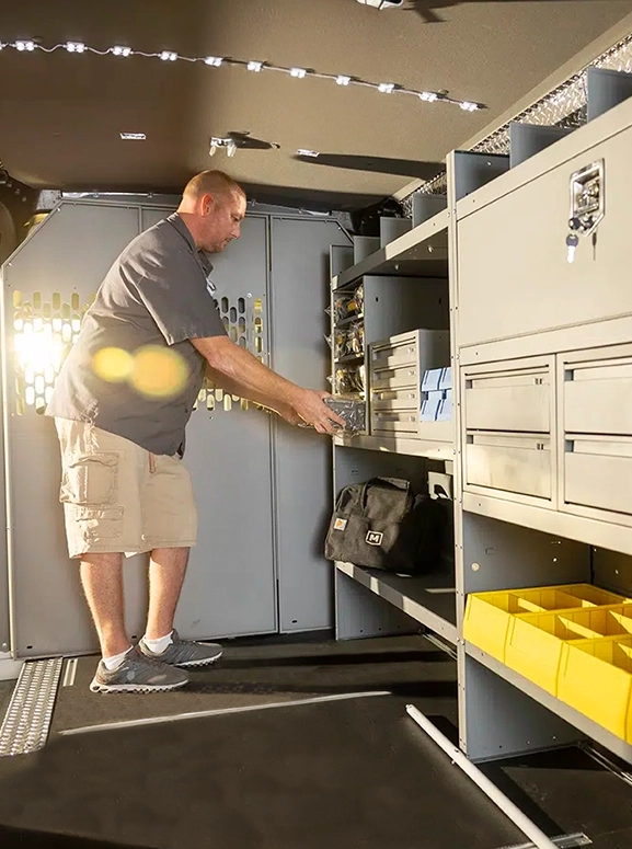 Upfitted with shelving and storage inside a work van